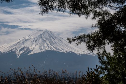 Close up top of Fuji mountain with snow cover on the top with could, fujisan