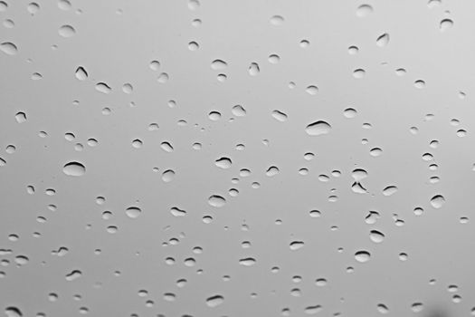 water rain drop on soft blue nature glass for abstract fresh background