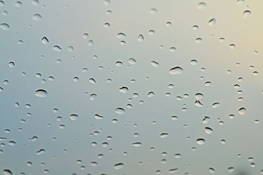 water rain drop on soft blue nature glass for abstract fresh background