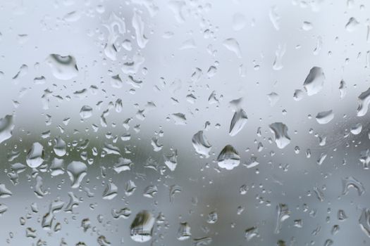 rain, water drop on glass window and rain condensation rainy storm season