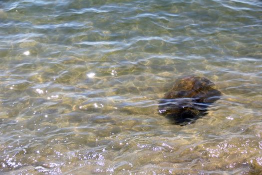 Crystal clear sea water and superb clean, See rocks on the bottom of the sea nature ocean, under water in beach clear and clean, Winter sea with travel tropical or summer holiday