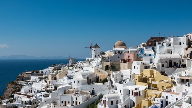 Windmill in Oia village of Santorini island , Greece