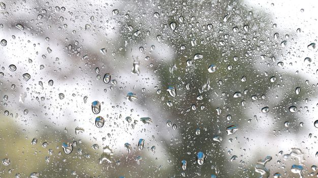Nature fresh wet background with water raindrops transparency on glass window mirror glass