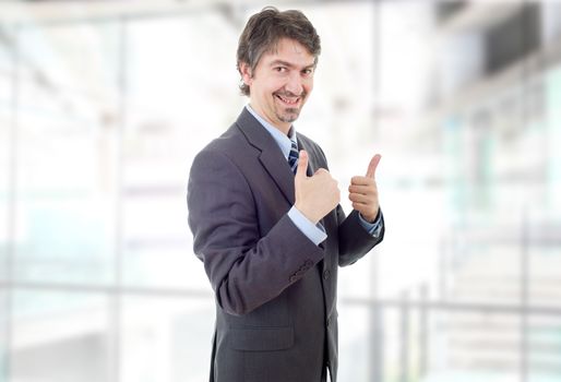 young business man going thumb up, at the office