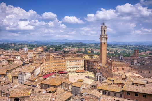 The Piazza del Campo with the Mangia tower in Siena town in the Tuscany region of Italy, Europe.
