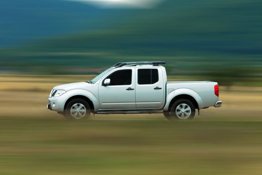 pick-up photographed driving fast