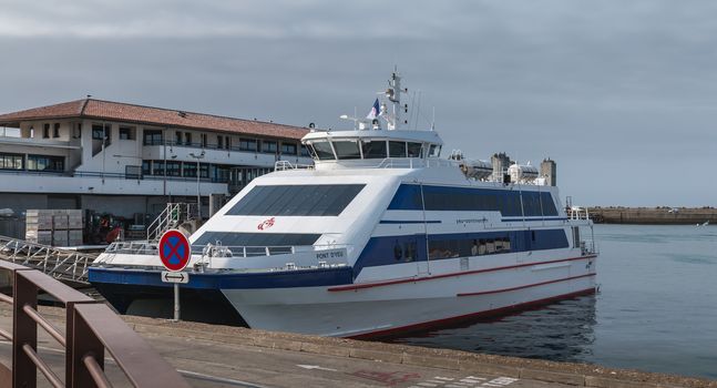 Port Joinville on the Isle of Yeu, France - September 18, 2018: Ferry Yeu Bridge of the company Yeu Continent parked in the sea port of Yeu Island on a fall day