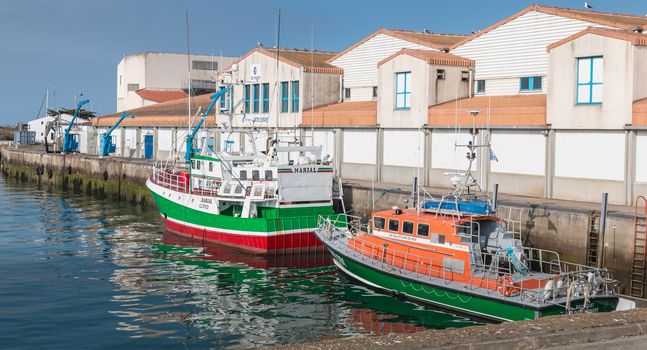 Joinville port on the island of Yeu, France - September 18, 2018: Trawler parked in the seaport of the island of Yeu on a fall day