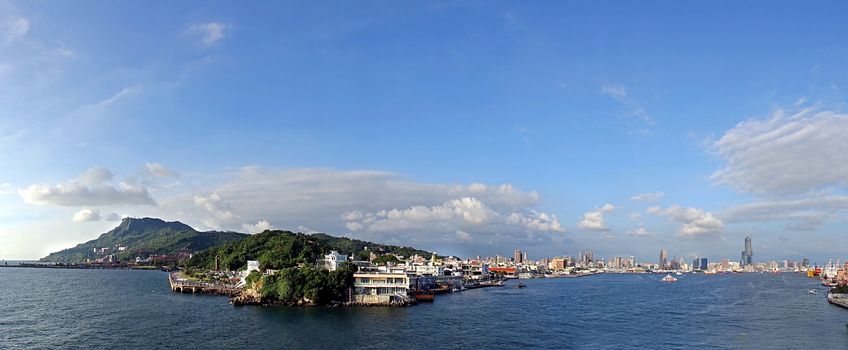 Panoramic view of the entrance to Kaohsiung harbor and city skyline
