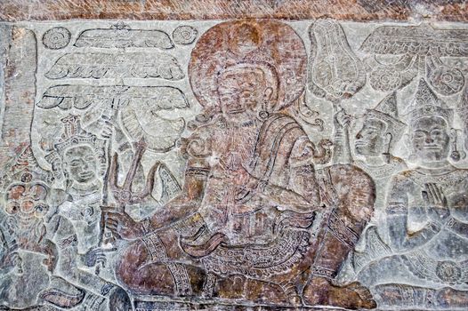 Bas relief carving of a old man on the wall of Angkor Wat temple in Siem Reap, Cambodia.