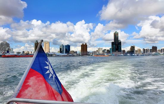 The skyline of Kaohsiung City in Taiwan seen from a boat
