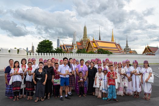 Bangkok, Thailand - August 25, 2017 : Unidentified Thai mourners wearing black color waiting in The Grand Palace to pay tribute and respect to their beloved Rama 9 Thai King Bhumibol Adulyadej