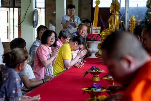 Ang Thong, Thailand - October 19, 2019 : Unidentified thai monk praying for religious ceremony in buddhist belief at Thai temple (Wat Thai)