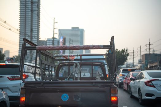 Bangkok, Thailand - January 17, 2020 : Cars on busy road in the Bangkok city, Thailand. Many cars use the street for transportation in rushhour with a traffic jam