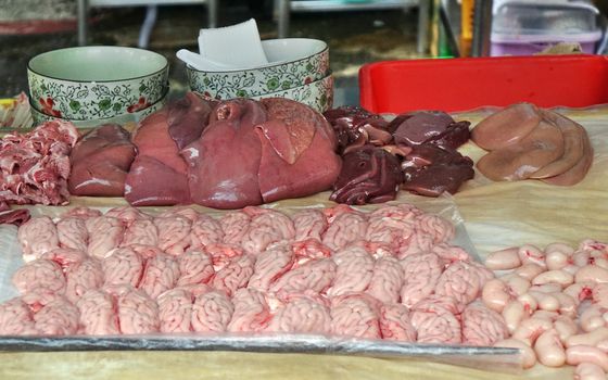 A night market stall in Taiwan offers inner organs to be cooked for customers
