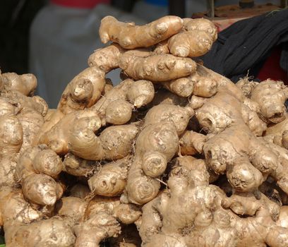Fully grown ginger roots for sale at a market stall