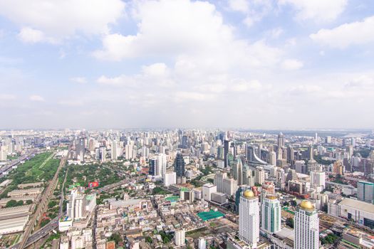 Bangkok, Thailand - August 28, 2016 : Cityscape and transportation with expressway and traffic in daytime from skyscraper of Bangkok. Bangkok is the capital and the most populous city of Thailand.