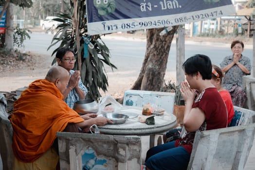 Ang Thong, Thailand - February 9, 2020 : Unidentified thai monk praying for religious ceremony in buddhist belief at Thai temple (Wat Thai)