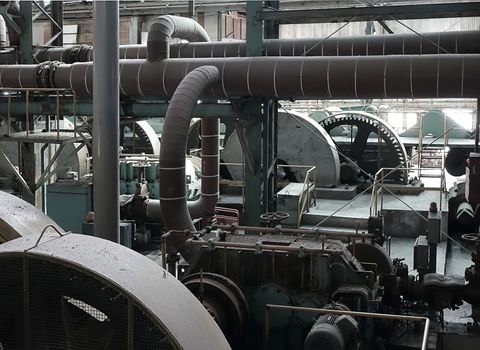 Rusting machinery and equipment in an abandoned old factory
