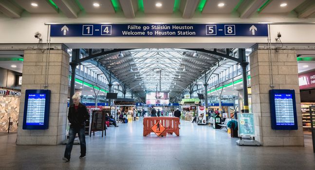 Dublin, Ireland - February 13, 2019: atmosphere inside Heuston train station where people walk in the city center on a winter day