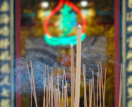 Incense sticks are being burned at a Chinese temple
