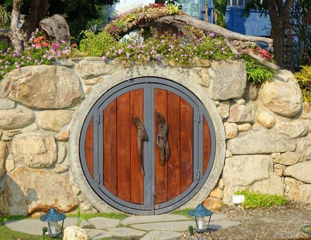 A Chinese garden with a traditional circular moon gate
