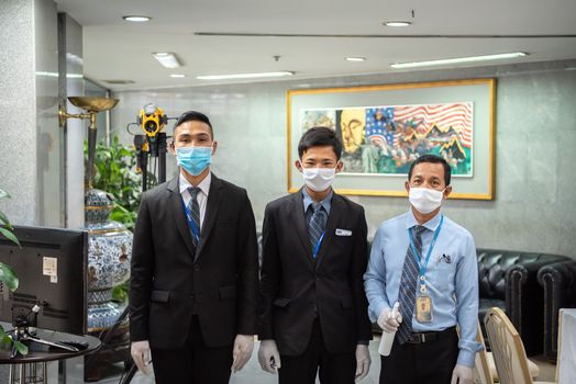 Bangkok, Thailand - March 18, 2020 : Unidentified people waiting body temperature check to access building for against epidemic flu covid19 or corona virus by thermoscan or infrared thermal camera