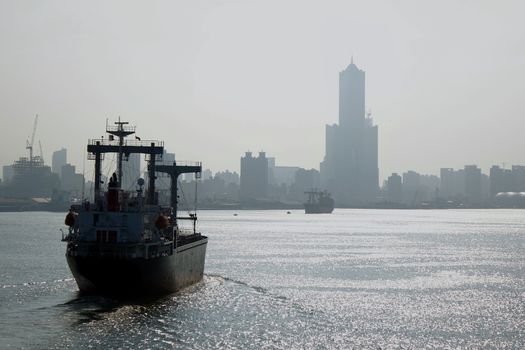 View from the harbor at the heavily polluted Kaohsiung City skyline
