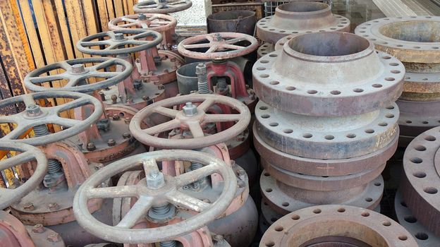 A collection of massive ship valves with large handwheels