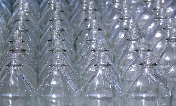 Rows of empty glass bottles with no caps