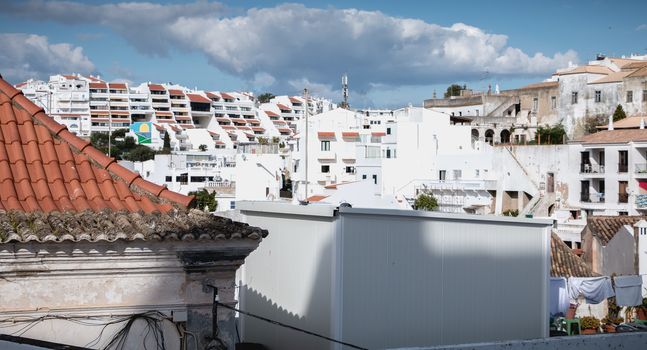 Albufeira, Portugal - May 3, 2018: view of typical buildings in the tourist town center on a spring day