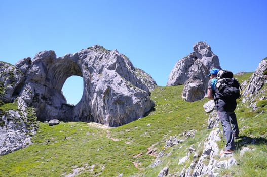 Man on a mountain path in Asturias, Spain.