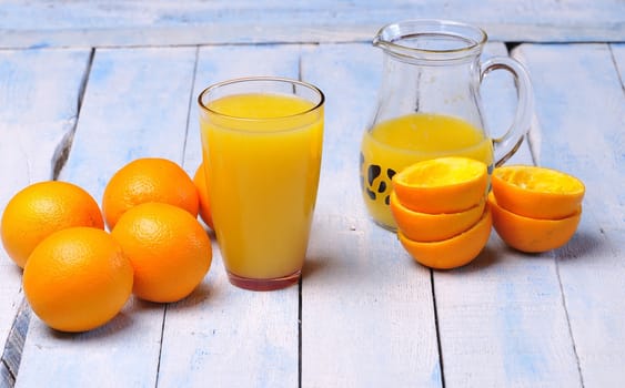 Freshly made orange juice on kitchen table.