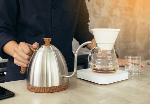 Barista brewing coffee, method pour over, drip coffee