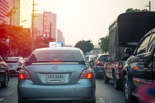 Bangkok, Thailand - January 17, 2020 : Cars on busy road in the Bangkok city, Thailand. Many cars use the street for transportation in rushhour with a traffic jam