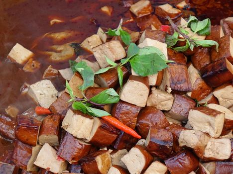 Pressed bean curd with chilies and fresh basil