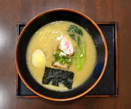 Japanese miso ramen noodles with seaweed, egg and vegetables

