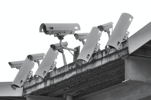A row of security and surveillance cameras