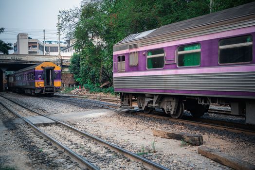 Bangkok, Thailand - January 17, 2020 : Unidentified railway train on the railroad tracks in Bangkok station. Many people in Thailand popular travel by train because it is cheaper.