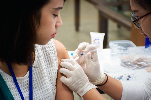 Bangkok, Thailand - September 23, 2016 : Unidentified patient asian woman health check by get vaccinated against the flu every year by the Ministry of Health.