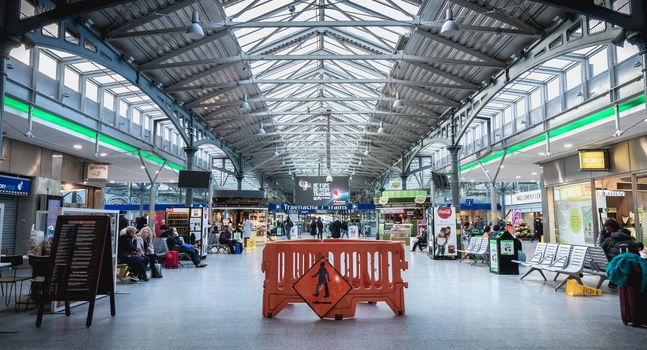 Dublin, Ireland - February 13, 2019: atmosphere inside Heuston train station where people walk in the city center on a winter day