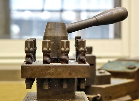 Well used industrial equipment with large nuts and bolts
