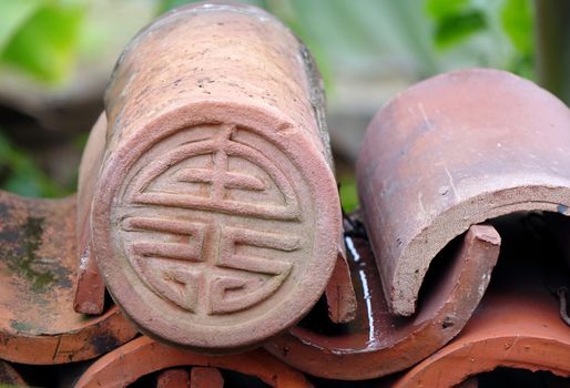 Kiln fired Chinese eave tile end with long life symbol
