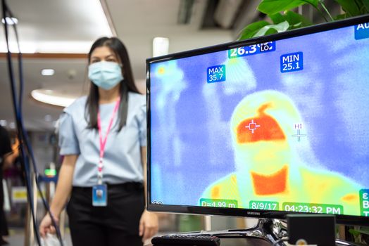 Bangkok, Thailand - March 18, 2020 : Unidentified people waiting body temperature check to access building for against epidemic flu covid19 or corona virus by thermoscan or infrared thermal camera