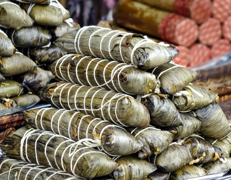 Rice is cooked wrapped in palm leaves, a native Taiwan specialty