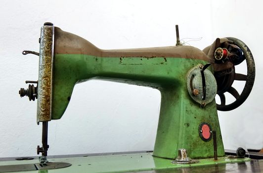 Vintage obsolete sewing machine that is operated by foot
