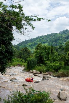 Rafting team , summer extreme water sport. Group of people in a rafting