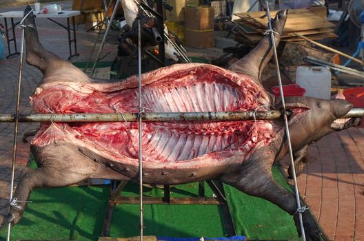 Traditional black haired pig carcass is ready for barbecue