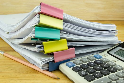 file folder and Stack of business report paper file with 

Calculator on the table in a work office, concept document in work office