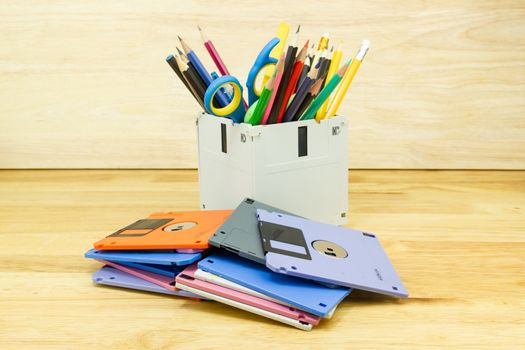 recycle floppy disk, Creative objects used for Store supplies such as pen pencils Scissors in a box on the table in work office, concept recycle floppy disk 